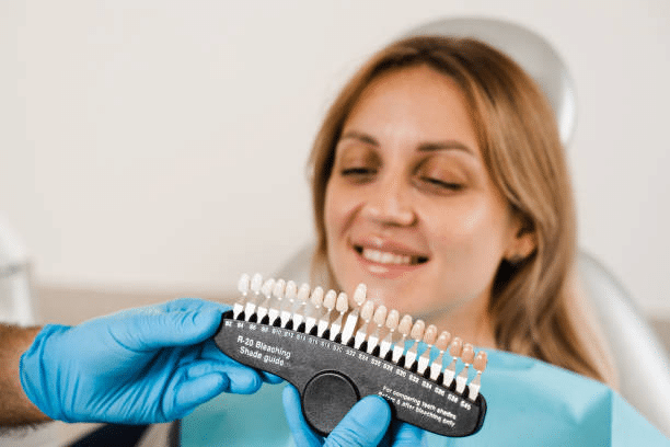 a patient choosing the right teeth palette color  for her