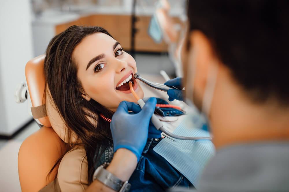 a woman on a dentist chair 