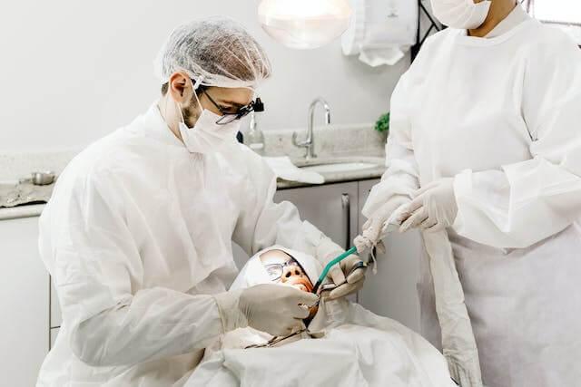 dental professionals performing a dental procedure