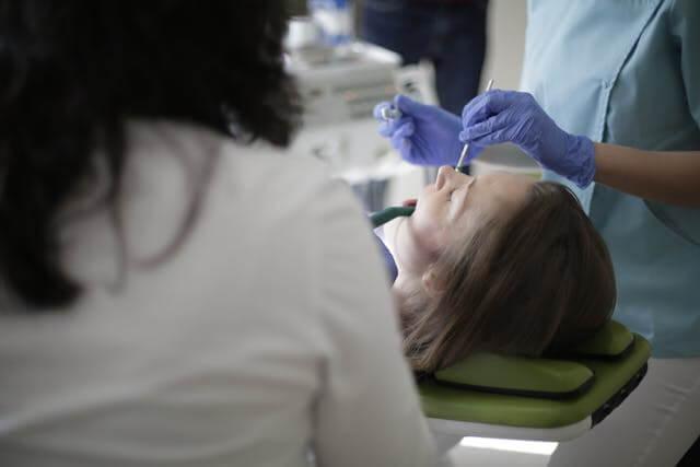 a woman receiving dental care